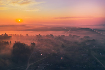 Beautiful morning sunrise with fog forest in Belarus