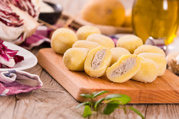 Potato gnocchi stuffed with radicchio and ricotta.