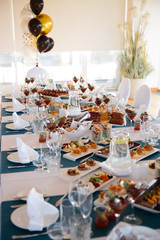 Food served on table in a white hall during a Birthday party in Eastern European Baltic Riga Latvia - Blue and teal colors - Canape, snacks and light drinks