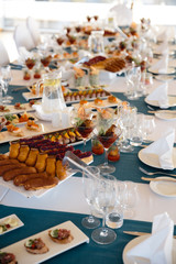 Food served on table in a white hall during a Birthday party in Eastern European Baltic Riga Latvia - Blue and teal colors - Canape, snacks and light drinks