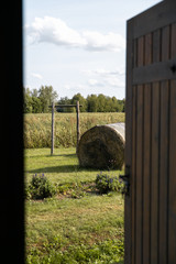 Landscape countryside typical in Eastern European Baltic Mazmezotnes Muiza in Latvia - Brick walls, bridges and hay