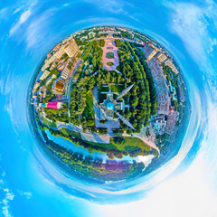 Beautiful futuristic panoramic (360 spherical panorama little planet) aerial drone view to city of Ust-Kamenogorsk (KZ: Oskemen), East Kazakhstan (Qazaqstan)