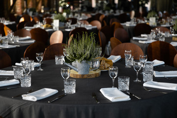 Food served on round table in a white hall during a Birthday corporate party in Eastern European Baltic Riga Latvia - Wooden ambar hall in countryside style - Canape, snacks and light drinks