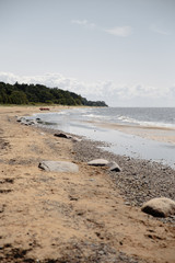 Fototapeta premium Moody foggy landscape at a Baltic Sea gulf in Jurmala Latvia beach - Boat in the background