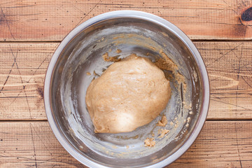 Step by step preparation of ginger cookies, step 2 - kneading the dough, top view, selective focus