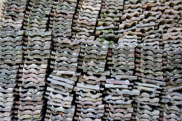 Roof tiles arranged on a wall, rural scene, pattern