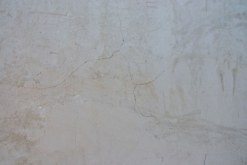 Old house wall texture with cracks, broken, gray background for designs, building exterior