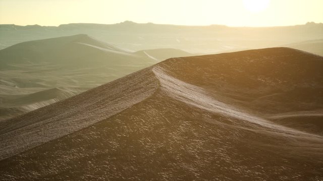 Aerial view on big sand dunes in Sahara desert at sunrise
