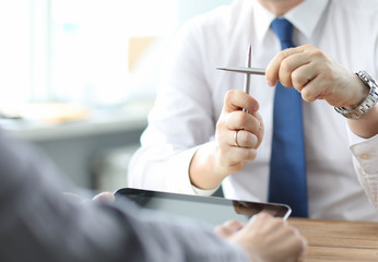 Oh no. Close up photo of sad upset unsatisfied marketer financier economist. He crossing two pens...