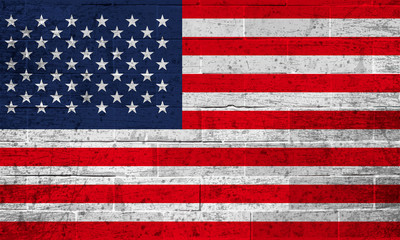 Flag of the United States of America on old brick wall background