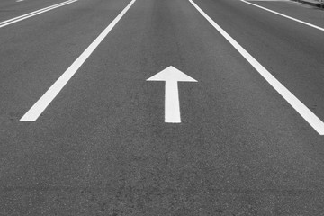 road with divide line and arrow