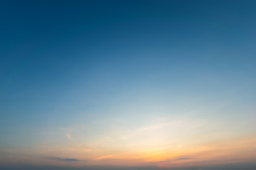 Dramadic Sunset Sky blue and orange light of the sun through the clouds in the sky