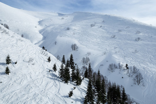 Mountain Freeride in Caucasus mountains covered snow. Alpine ski resort Krasnaya Polyana in Russia. Natural winter landscape.