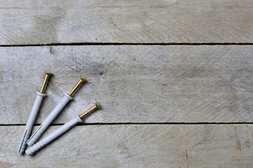 dowels on wooden background.copy space.