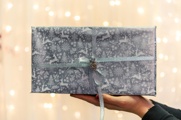 Girl celebrates New Year 2020 in winter. Shopping black friday sale concept for shop.