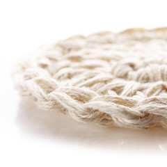 Handmade crocheted eco baskets made of hemp thread on a white background.