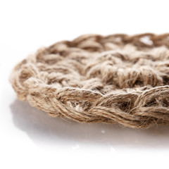 Handmade crocheted eco baskets made of hemp thread on a white background.