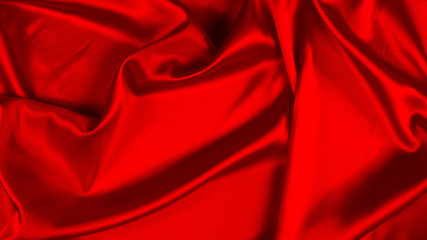 Obraz premium Red silk or satin luxury fabric texture can use as abstract background. Top view.