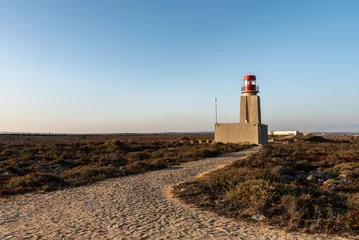 Papier Peint photo Atlantic Ocean Road lighthouse on the coast of the atlantic ocean. Landscape of nature reserve area inside the fortress of Sagres (Fortaleza de Sagres), Cabo de Sao Vicente, Algarve, Portugal