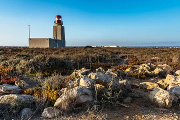 Papier Peint photo Atlantic Ocean Road lighthouse on the coast. Landscape of nature reserve area inside the fortress of Sagres (Fortaleza de Sagres), Cabo de Sao Vicente, Algarve, Portugal