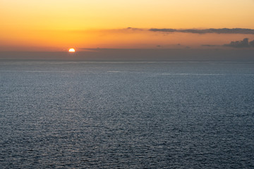 Obraz premium Bright sunset with orange sun above the sea surface. Atlantic ocean.