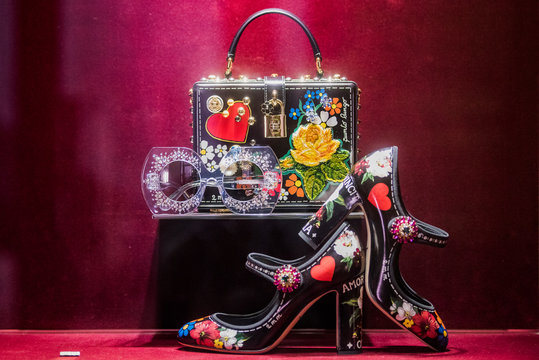 Milan, Italy – September 23, 2017: Dolce Gabbana shoes and bags in a front store in Milan  - during SS2018 Fashion Week.