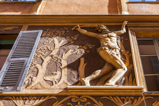 Nice, France, October 10, 2019. Typical architecture of the Provence region. Fragment of the bas-relief on the residential house Maison d 'Adam et Eve (grizzle technique, 1584)