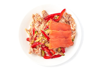 Japanese salad with salmon fillet, Beijing cabbage, cucumber, Japanese salad. With beef, paprika and kim-chi sauce. On a white plate. Isolated. White background. View from above.