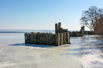 old breakwater in the river - 308255273