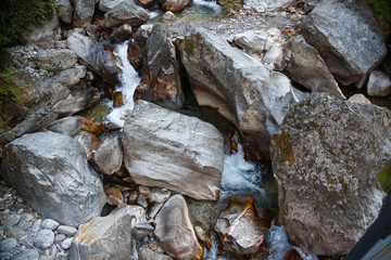 A mountain stream among the big boulders