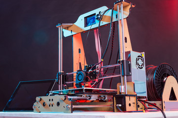 Electronic three dimensional plastic printer during work in laboratory, 3D printer, 3D printing