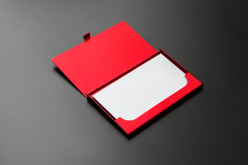 red business card case opened with cards