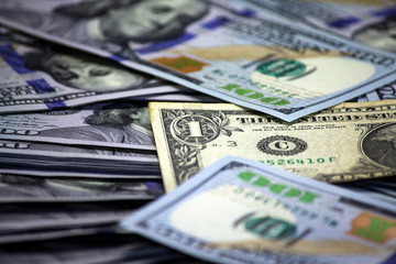 One dollar bill on a pack of dollars background 2