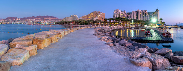 Night panoramic view from public walking pier on central beach and promenade of Eilat - famous tourist resort and recreational city in Israel © sergei_fish13