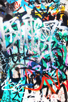 Fototapeta Closeup of damaged colorful urban wall texture