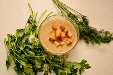 Mushroom soup with vegetables, garlic croutons and herbs