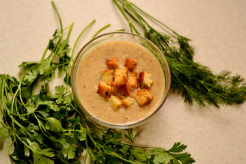 Mushroom soup with vegetables, garlic croutons and herbs