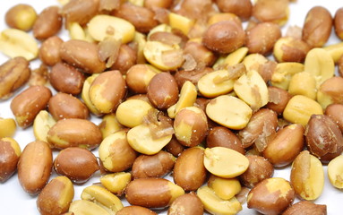 salt peanut with red peel arranging on white background