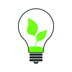 green eco energy concept with plant growing inside a light bulb