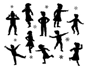 A set of children in silhouette playing having fun in Christmas or winter cold weather clothing