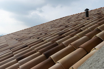 Roof in the foreground with brick tiles