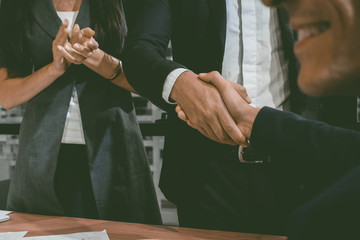 Group of business people working and communicating while sitting at the office desk together background.