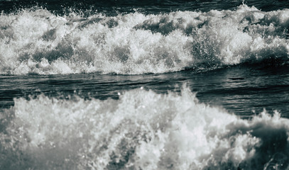 Sea waves breaking at shore