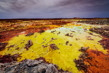 Minerals and sulfuric acid pouring out gives the Dallol its colors