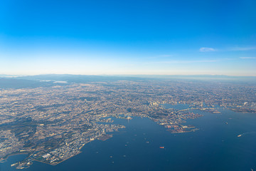 Aerial view of Yokohama City, Kawasaki city and Ota city in sunrise time with blue sky horizon background, Tokyo, Japan