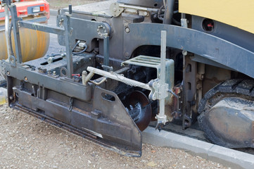 Fototapeta na wymiar asphalt paver machine during road construction works