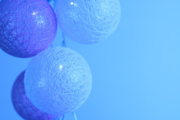 Garland from balls toned in blue color