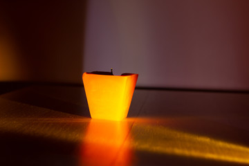 Extinguished candle on black background with copy space