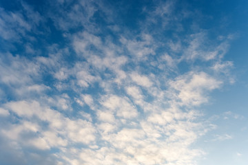The blue sky in cirrus clouds at sunset