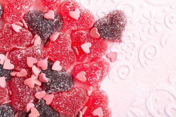 Mixed heart shaped marmalade, colorful love sweets, candy jellies sprinkled with sugar crumbs